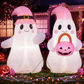 Two cute white ghost inflatables in pink witch hats, one holding a pink pumpkin pail