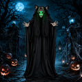 Tall hooded figure in a black robe with a glowing green face and raised clawed hands at night