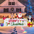 Long Merry Christmas banner inflatable with Santa, a reindeer and a penguin in a snowy front yard