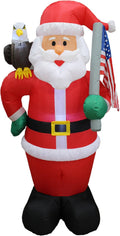 Santa inflatable holding an American flag with a bald eagle on his shoulder