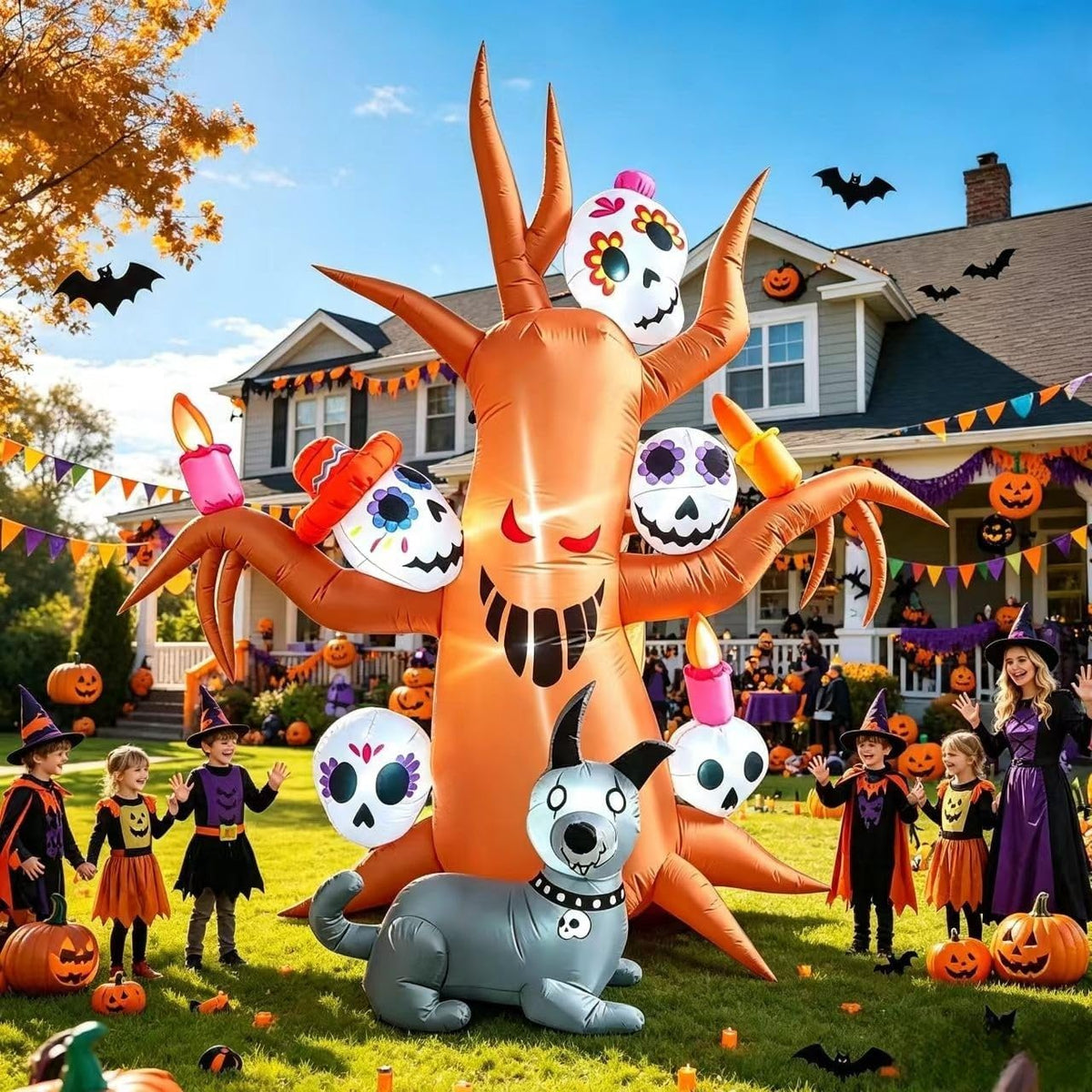 Orange haunted tree inflatable with sugar skulls in the branches and a gray skeleton dog, kids in costume nearby
