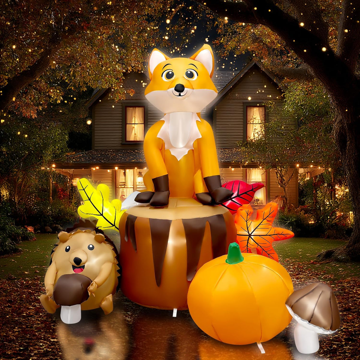 Fox sitting on a tree stump with a hedgehog, pumpkin and mushroom inflatable in a fall yard
